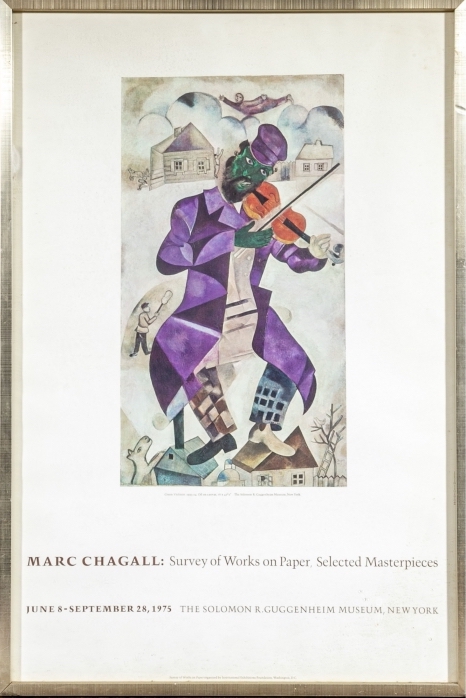 An advertisement poster for a Marc Chagall exhibit at the Guggenheim Museum featuring The Green Violinist work
